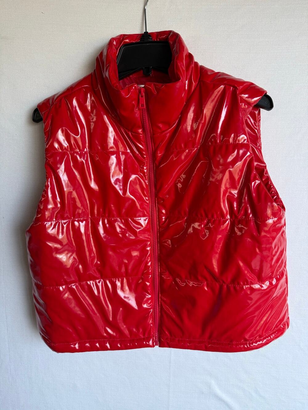 Who’s that girl? Shiny Red Puffer Vest